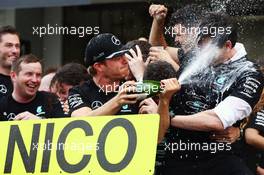 Race winner Nico Rosberg (GER) Mercedes AMG F1 celebrates winning the constructors' championship with Toto Wolff (GER) Mercedes AMG F1 Shareholder and Executive Director and the team. 09.10.2016. Formula 1 World Championship, Rd 17, Japanese Grand Prix, Suzuka, Japan, Race Day.