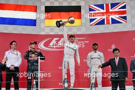 The podium (L to R): Max Verstappen (NLD) Red Bull Racing, second; Nico Rosberg (GER) Mercedes AMG F1, race winner; Lewis Hamilton (GBR) Mercedes AMG F1, third. 09.10.2016. Formula 1 World Championship, Rd 17, Japanese Grand Prix, Suzuka, Japan, Race Day.