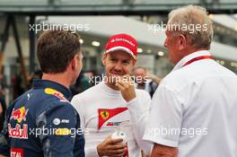 (L to R): Christian Horner (GBR) Red Bull Racing Team Principal with Sebastian Vettel (GER) Ferrari and Dr Helmut Marko (AUT) Red Bull Motorsport Consultant. 08.10.2016. Formula 1 World Championship, Rd 17, Japanese Grand Prix, Suzuka, Japan, Qualifying Day.