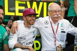 Race winner Lewis Hamilton (GBR) Mercedes AMG F1 celebrates with Dr. Dieter Zetsche (GER) Daimler AG CEO and the team. 29.05.2015. Formula 1 World Championship, Rd 6, Monaco Grand Prix, Monte Carlo, Monaco, Race Day.