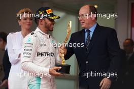 Race winner Lewis Hamilton (GBR) Mercedes AMG F1 celebrates on the podium with HSH Prince Albert of Monaco (MON). 29.05.2015. Formula 1 World Championship, Rd 6, Monaco Grand Prix, Monte Carlo, Monaco, Race Day.