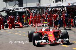 Kimi Raikkonen (FIN) Ferrari SF16-H and Sebastian Vettel (GER) Ferrari SF16-H in the pits. 28.05.2016. Formula 1 World Championship, Rd 6, Monaco Grand Prix, Monte Carlo, Monaco, Qualifying Day.