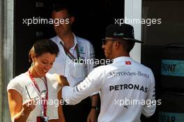 Lewis Hamilton (GBR) Mercedes AMG F1 with Nora Zetsche (GER). 28.05.2016. Formula 1 World Championship, Rd 6, Monaco Grand Prix, Monte Carlo, Monaco, Qualifying Day.