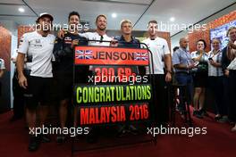 Jenson Button (GBR), McLaren Honda celebrates 300GP, Daniel Ricciardo (AUS), Red Bull Racing, Stoffel Vandoorne (BEL), third driver, McLaren F1 Team  30.09.2016. Formula 1 World Championship, Rd 16, Malaysian Grand Prix, Sepang, Malaysia, Friday.