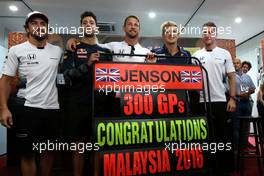 Jenson Button (GBR), McLaren Honda celebrates 300GP, Daniel Ricciardo (AUS), Red Bull Racing, Stoffel Vandoorne (BEL), third driver, McLaren F1 Team and Marcus Ericsson (SWE), Sauber F1 Team  30.09.2016. Formula 1 World Championship, Rd 16, Malaysian Grand Prix, Sepang, Malaysia, Friday.