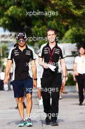 (L to R): Sergio Perez (MEX) Sahara Force India F1 with Will Hings (GBR) Sahara Force India F1 Press Officer. 30.09.2016. Formula 1 World Championship, Rd 16, Malaysian Grand Prix, Sepang, Malaysia, Friday.