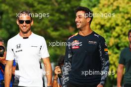 (L to R): Jenson Button (GBR) McLaren with Daniel Ricciardo (AUS) Red Bull Racing. 30.09.2016. Formula 1 World Championship, Rd 16, Malaysian Grand Prix, Sepang, Malaysia, Friday.