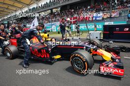 Daniel Ricciardo (AUS) Red Bull Racing RB12 on the grid. 02.10.2016. Formula 1 World Championship, Rd 16, Malaysian Grand Prix, Sepang, Malaysia, Sunday.
