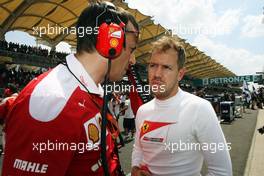 Sebastian Vettel (GER) Ferrari on the grid. 02.10.2016. Formula 1 World Championship, Rd 16, Malaysian Grand Prix, Sepang, Malaysia, Sunday.