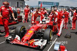 Sebastian Vettel (GER) Ferrari SF16-H on the grid. 02.10.2016. Formula 1 World Championship, Rd 16, Malaysian Grand Prix, Sepang, Malaysia, Sunday.