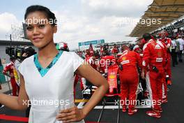Grid girl for Sebastian Vettel (GER) Ferrari SF16-H. 02.10.2016. Formula 1 World Championship, Rd 16, Malaysian Grand Prix, Sepang, Malaysia, Sunday.
