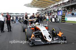 Sergio Perez (MEX) Sahara Force India F1 VJM09 on the grid. 02.10.2016. Formula 1 World Championship, Rd 16, Malaysian Grand Prix, Sepang, Malaysia, Sunday.