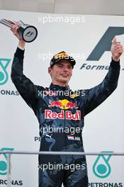 Max Verstappen (NLD) Red Bull Racing celebrates his second position on the podium. 02.10.2016. Formula 1 World Championship, Rd 16, Malaysian Grand Prix, Sepang, Malaysia, Sunday.