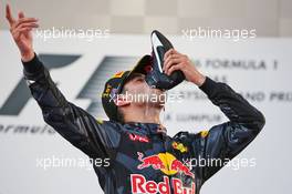 Race winner Daniel Ricciardo (AUS) Red Bull Racing celebrates on the podium by drinking champagne from his race boot. 02.10.2016. Formula 1 World Championship, Rd 16, Malaysian Grand Prix, Sepang, Malaysia, Sunday.