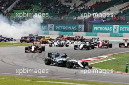 Lewis Hamilton (GBR) Mercedes AMG F1 W07 Hybrid leads at the start of the race as team mate Nico Rosberg (GER) Mercedes AMG F1 W07 Hybrid recovers from a collision. 02.10.2016. Formula 1 World Championship, Rd 16, Malaysian Grand Prix, Sepang, Malaysia, Sunday.