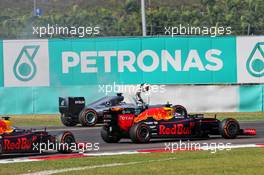 Lewis Hamilton (GBR) Mercedes AMG F1 W07 Hybrid retired from the race with a blown engine, and is passed by Daniel Ricciardo (AUS) Red Bull Racing RB12 and Max Verstappen (NLD) Red Bull Racing RB12. 02.10.2016. Formula 1 World Championship, Rd 16, Malaysian Grand Prix, Sepang, Malaysia, Sunday.
