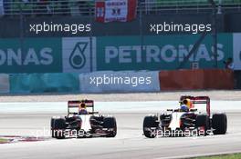 (L to R): Max Verstappen (NLD) Red Bull Racing RB12 battle for position with team mate Daniel Ricciardo (AUS) Red Bull Racing RB12. 02.10.2016. Formula 1 World Championship, Rd 16, Malaysian Grand Prix, Sepang, Malaysia, Sunday.