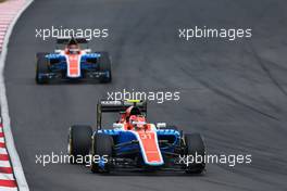 Esteban Ocon (FRA) Manor Racing MRT05 leads team mate Pascal Wehrlein (GER) Manor Racing MRT05. 02.10.2016. Formula 1 World Championship, Rd 16, Malaysian Grand Prix, Sepang, Malaysia, Sunday.
