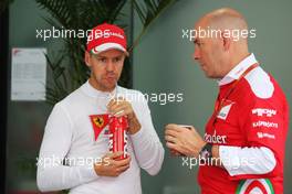(L to R): Sebastian Vettel (GER) Ferrari with Jock Clear (GBR) Ferrari Engineering Director. 01.10.2016. Formula 1 World Championship, Rd 16, Malaysian Grand Prix, Sepang, Malaysia, Saturday.