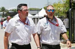 (L to R): Eric Boullier (FRA) McLaren Racing Director with Bruno Michel (FRA) GP2 CEO. 02.10.2016. Formula 1 World Championship, Rd 16, Malaysian Grand Prix, Sepang, Malaysia, Sunday.