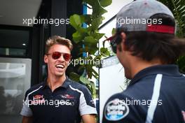 (L to R): Daniil Kvyat (RUS) Scuderia Toro Rosso with Carlos Sainz Jr (ESP) Scuderia Toro Rosso. 29.09.2016. Formula 1 World Championship, Rd 16, Malaysian Grand Prix, Sepang, Malaysia, Thursday.