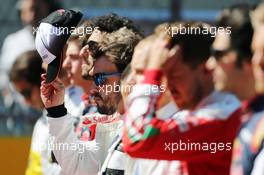 Fernando Alonso (ESP) McLaren as the grid observes the national anthem. 01.05.2016. Formula 1 World Championship, Rd 4, Russian Grand Prix, Sochi Autodrom, Sochi, Russia, Race Day.