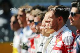 Sebastian Vettel (GER) Ferrari as the grid observes the national anthem. 01.05.2016. Formula 1 World Championship, Rd 4, Russian Grand Prix, Sochi Autodrom, Sochi, Russia, Race Day.