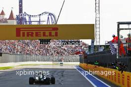 Race winner Nico Rosberg (GER) Mercedes AMG F1 W07 Hybrid takes the chequered flag at the end of the race. 01.05.2016. Formula 1 World Championship, Rd 4, Russian Grand Prix, Sochi Autodrom, Sochi, Russia, Race Day.