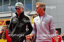 (L to R): Nico Hulkenberg (GER) Sahara Force India F1 with Nico Rosberg (GER) Mercedes AMG F1 on the drivers parade. 01.05.2016. Formula 1 World Championship, Rd 4, Russian Grand Prix, Sochi Autodrom, Sochi, Russia, Race Day.