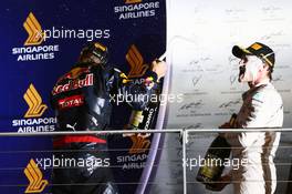 Daniel Ricciardo (AUS) Red Bull Racing celebrates his second position on the podium with race winner Nico Rosberg (GER) Mercedes AMG F1. 18.09.2016. Formula 1 World Championship, Rd 15, Singapore Grand Prix, Marina Bay Street Circuit, Singapore, Race Day.