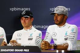 Lewis Hamilton (GBR) Mercedes AMG F1 (Right) with team mate Nico Rosberg (GER) Mercedes AMG F1 in the FIA Press Conference. 18.09.2016. Formula 1 World Championship, Rd 15, Singapore Grand Prix, Marina Bay Street Circuit, Singapore, Race Day.