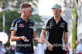 (L to R): Daniil Kvyat (RUS) Scuderia Toro Rosso with Nico Hulkenberg (GER) Sahara Force India F1. 18.09.2016. Formula 1 World Championship, Rd 15, Singapore Grand Prix, Marina Bay Street Circuit, Singapore, Race Day.