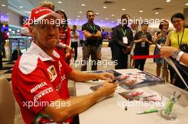 Sebastian Vettel (GER) Ferrari signs autographs for the fans. 15.09.2016. Formula 1 World Championship, Rd 15, Singapore Grand Prix, Marina Bay Street Circuit, Singapore, Preparation Day.