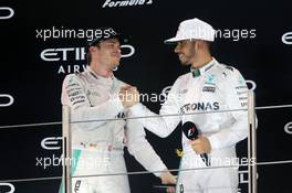The podium (L to R): second placed Nico Rosberg (GER) Mercedes AMG F1 celebrates his World Championship with race winner and team mate Lewis Hamilton (GBR) Mercedes AMG F1. 27.11.2016. Formula 1 World Championship, Rd 21, Abu Dhabi Grand Prix, Yas Marina Circuit, Abu Dhabi, Race Day.