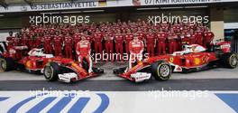 (L to R): Sebastian Vettel (GER) Ferrari and team mate Kimi Raikkonen (FIN) Ferrari at a team photograph. 24.11.2016. Formula 1 World Championship, Rd 21, Abu Dhabi Grand Prix, Yas Marina Circuit, Abu Dhabi, Preparation Day.