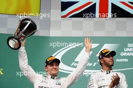 (L to R): Nico Rosberg (GER) Mercedes AMG F1 celebrates his second position on the podium with race winner Lewis Hamilton (GBR) Mercedes AMG F1. 23.10.2016. Formula 1 World Championship, Rd 18, United States Grand Prix, Austin, Texas, USA, Race Day.