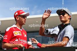 (L to R): Sebastian Vettel (GER) Ferrari with Pascal Wehrlein (GER) Manor Racing on the drivers parade. 23.10.2016. Formula 1 World Championship, Rd 18, United States Grand Prix, Austin, Texas, USA, Race Day.