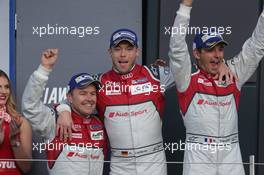 (L to R): Race winners Marcel Fassler (SUI) / Andre Lotterer (GER) / Benoit Treluyer (FRA) #07 Audi Sport Team Joest Audi R18 celebrate on the podium. 17.04.2016. FIA World Endurance Championship, Round 1, Silverstone, England, Sunday.