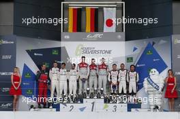 The podium (L to R):  Marc Lieb (GER), Romain Dumas (FRA), Neel Jani (SUI) #02 Porsche Team Porsche 919 Hybrid, second; Andre Lotterer (GER), Marcel Fassler (SUI), Benoit Treluyer (FRA) #07 Audi Sport Team Joest Audi R18, race winners; Mike Conway (GBR), Stephane Sarrazin (FRA), Kamui Kobayashi (JPN) #06 Toyota Gazoo Racing Toyota TS050 Hybrid, third.  17.04.2016. FIA World Endurance Championship, Round 1, Silverstone, England, Sunday.