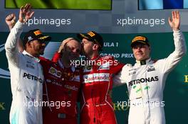 1st place Sebastian Vettel (GER) Ferrari, 2nd Lewis Hamilton (GBR) Mercedes AMG F1 and 3rd place Valtteri Bottas (FIN) Mercedes AMG F1. 26.03.2017. Formula 1 World Championship, Rd 1, Australian Grand Prix, Albert Park, Melbourne, Australia, Race Day.