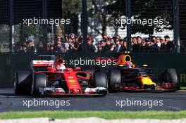 Max Verstappen (NLD) Red Bull Racing RB13 and Sebastian Vettel (GER) Ferrari SF70H battle for position. 26.03.2017. Formula 1 World Championship, Rd 1, Australian Grand Prix, Albert Park, Melbourne, Australia, Race Day.