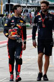 Daniel Ricciardo (AUS) Red Bull Racing with Sam Village (GBR) Red Bull Racing Personal Trainer. 25.03.2017. Formula 1 World Championship, Rd 1, Australian Grand Prix, Albert Park, Melbourne, Australia, Qualifying Day.
