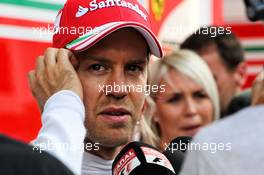 Sebastian Vettel (GER) Ferrari with the media. 07.07.2017. Formula 1 World Championship, Rd 9, Austrian Grand Prix, Spielberg, Austria, Practice Day.
