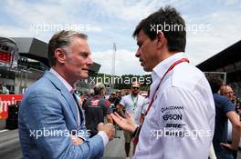 (L to R): Sean Bratches (USA) Formula 1 Managing Director, Commercial Operations with Toto Wolff (GER) Mercedes AMG F1 Shareholder and Executive Director on the grid. 09.07.2017. Formula 1 World Championship, Rd 9, Austrian Grand Prix, Spielberg, Austria, Race Day.