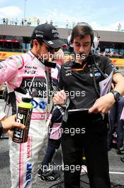 Sergio Perez (MEX) Sahara Force India F1 with Tim Wright (GBR) Sahara Force India F1 Team Race Engineer on the grid. 09.07.2017. Formula 1 World Championship, Rd 9, Austrian Grand Prix, Spielberg, Austria, Race Day.