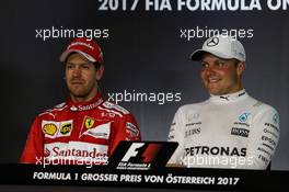 (L to R): Sebastian Vettel (GER) Ferrari and Valtteri Bottas (FIN) Mercedes AMG F1 in the post race FIA Press Conference. 09.07.2017. Formula 1 World Championship, Rd 9, Austrian Grand Prix, Spielberg, Austria, Race Day.
