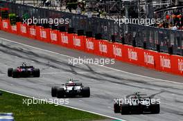 Carlos Sainz Jr (ESP) Scuderia Toro Rosso STR12 leads Lance Stroll (CDN) Williams FW40 and Kevin Magnussen (DEN) Haas VF-17. 09.07.2017. Formula 1 World Championship, Rd 9, Austrian Grand Prix, Spielberg, Austria, Race Day.