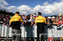 (L to R): Nico Hulkenberg (GER) Renault Sport F1 Team and team mate Jolyon Palmer (GBR) Renault Sport F1 Team sign autographs for the fans. 06.07.2017. Formula 1 World Championship, Rd 9, Austrian Grand Prix, Spielberg, Austria, Preparation Day.