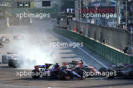 Carlos Sainz Jr (ESP) Scuderia Toro Rosso STR12 and Fernando Alonso (ESP) McLaren MCL32 at the restart. 25.06.2017. Formula 1 World Championship, Rd 8, Azerbaijan Grand Prix, Baku Street Circuit, Azerbaijan, Race Day.