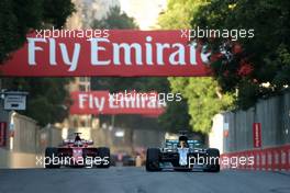 Lewis Hamilton (GBR) Mercedes AMG F1  andSebastian Vettel (GER) Scuderia Ferrari  25.06.2017. Formula 1 World Championship, Rd 8, Azerbaijan Grand Prix, Baku Street Circuit, Azerbaijan, Race Day.